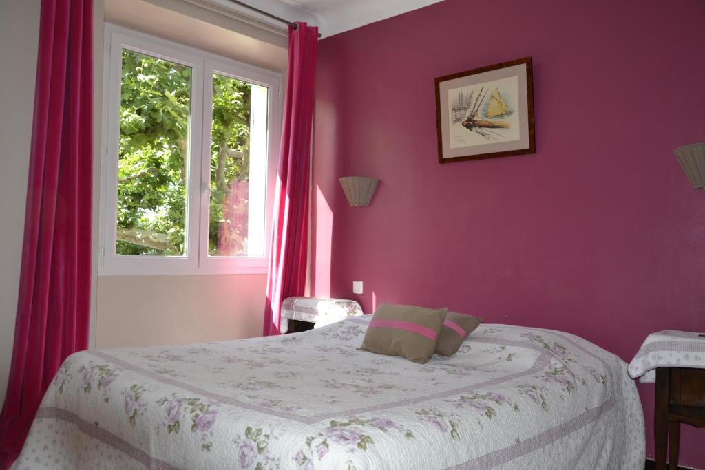 Postel nebo postele na pokoji v ubytování Hotellerie de l'Esplanade