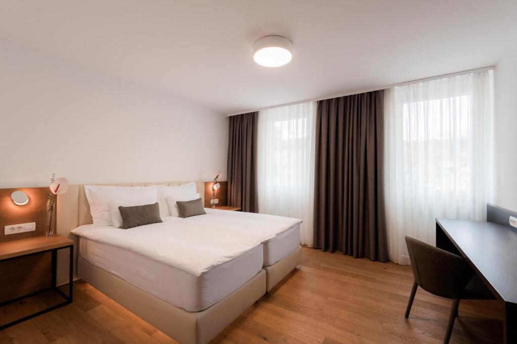 Postel nebo postele na pokoji v ubytování Hotel Ajdovec