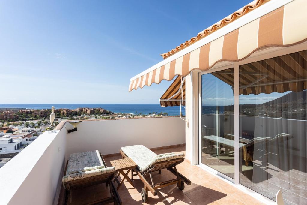 a balcony with a view of the ocean at Penthouse Palm Mar in Palm-Mar