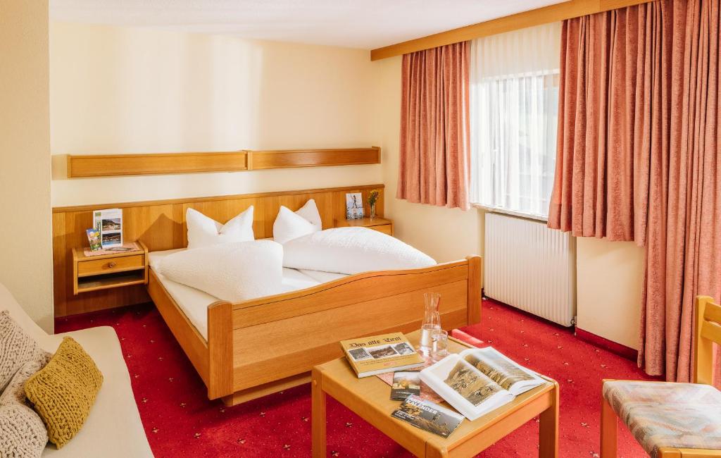 Postel nebo postele na pokoji v ubytování Hotel Wiese
