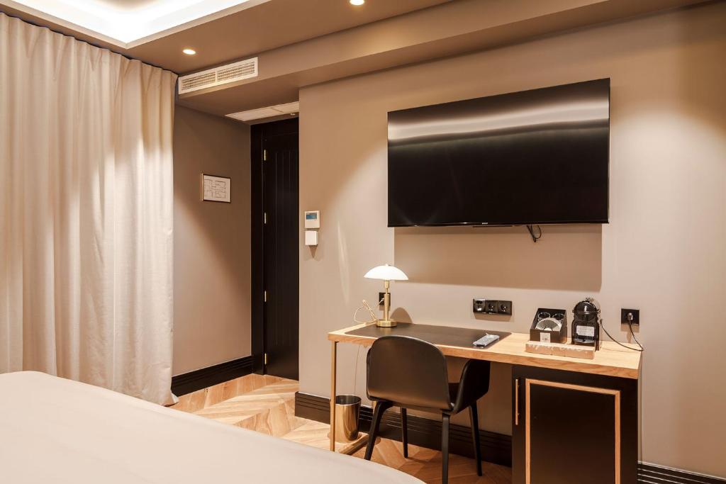 TV a/nebo společenská místnost v ubytování IBIZA ROOMs