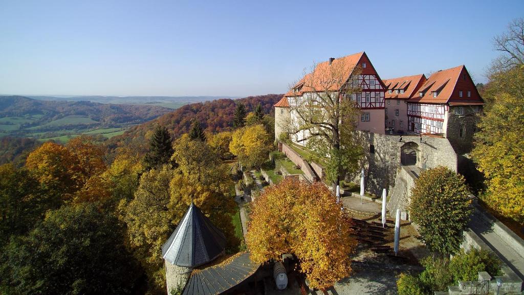 an aerial view of a building on a hill at Burg Bodenstein in Adelsborn