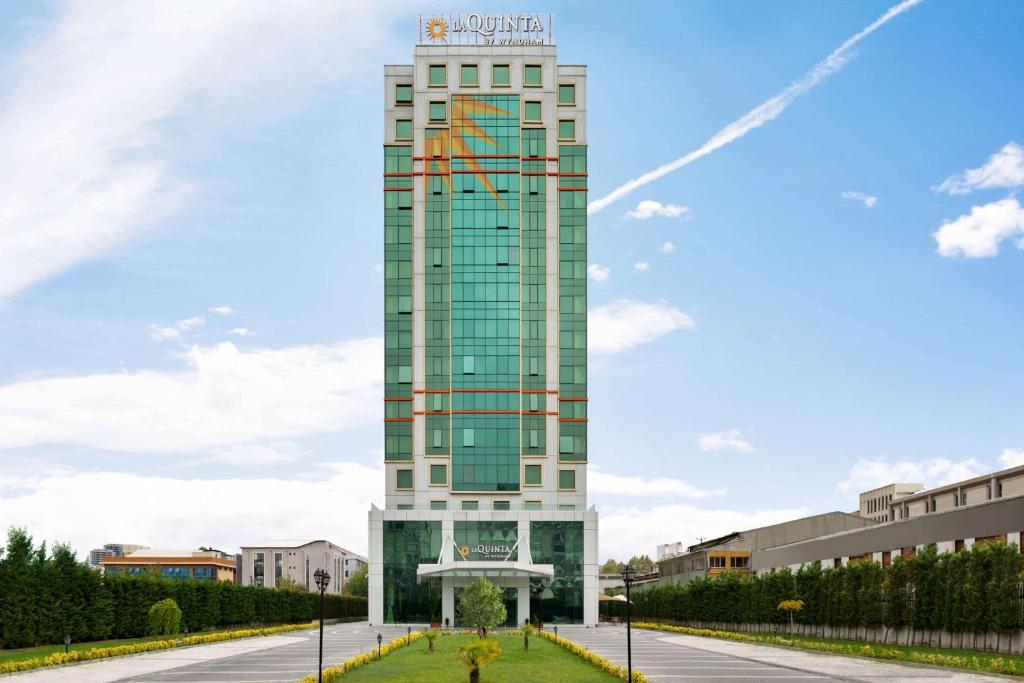 a tall building with a clock on top of it at La Quinta by Wyndham Istanbul Gunesli in Istanbul