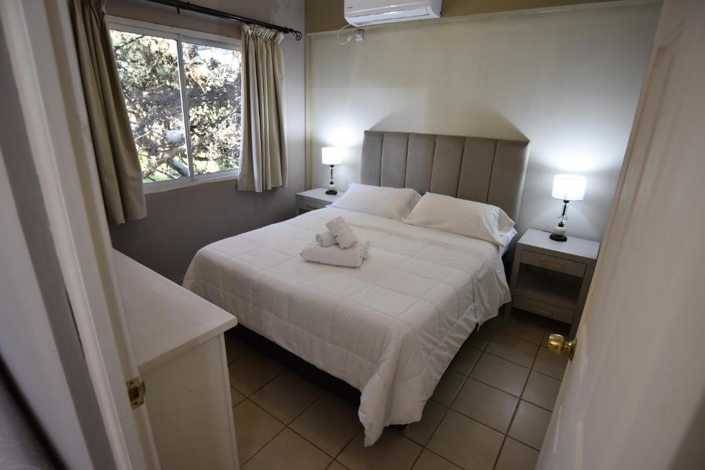Cama o camas de una habitación en Altos de Pinamar