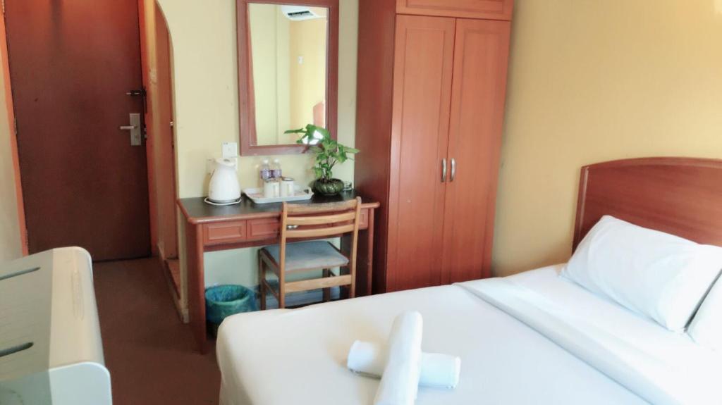 Postel nebo postele na pokoji v ubytování Hotel Millenium