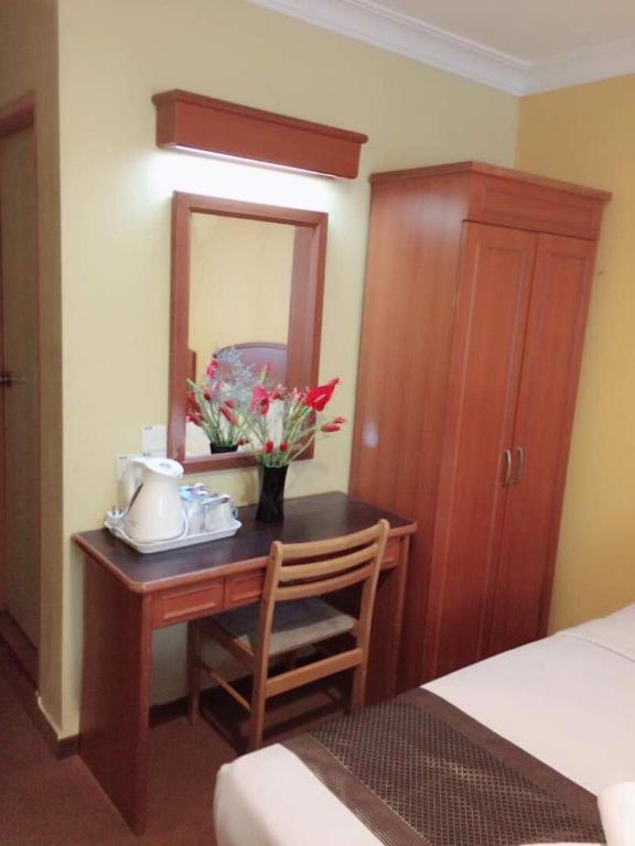 Postel nebo postele na pokoji v ubytování Hotel Millenium
