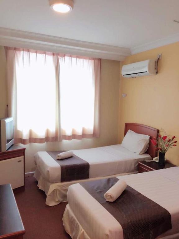 Postel nebo postele na pokoji v ubytování Hotel Millenium