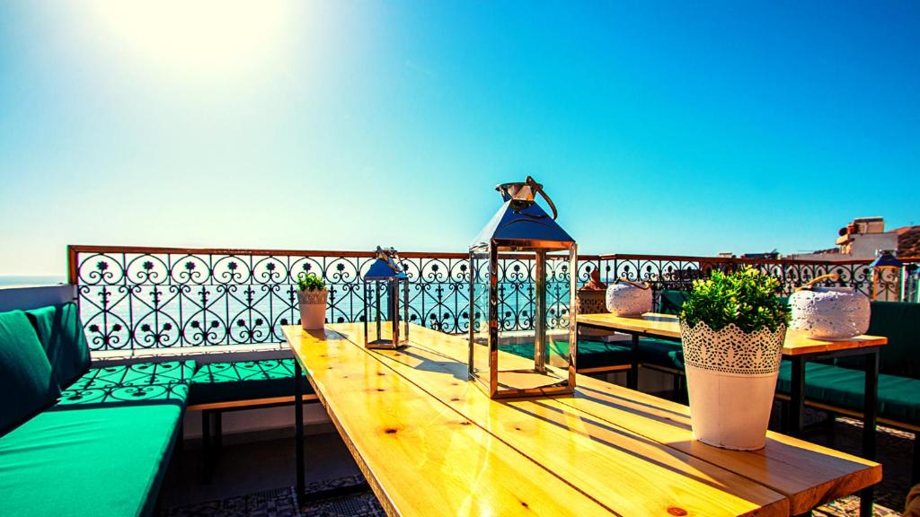 a balcony with benches and a gazebo at THE HORIZON in Taghazout