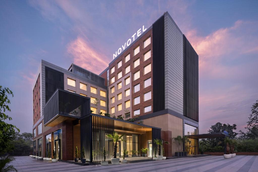 a rendering of a hotel with a building at Novotel Chandigarh Tribune Chowk in Chandīgarh
