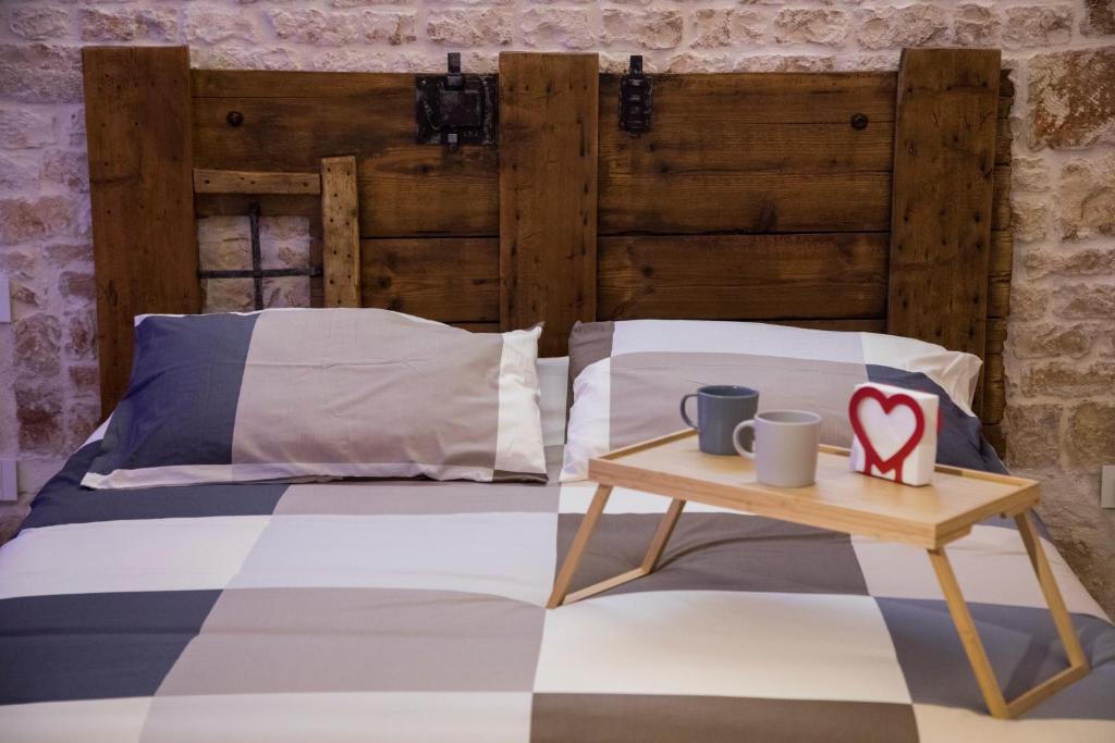 Łóżko lub łóżka w pokoju w obiekcie SINFONIE PUGLIESI LUXURY ROOM