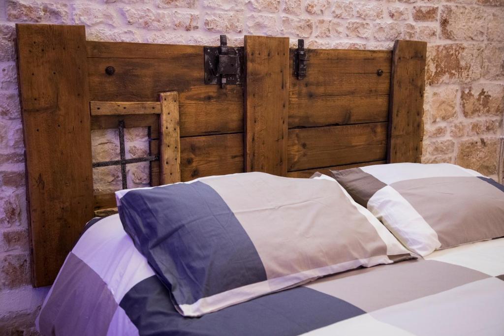 Łóżko lub łóżka w pokoju w obiekcie SINFONIE PUGLIESI LUXURY ROOM