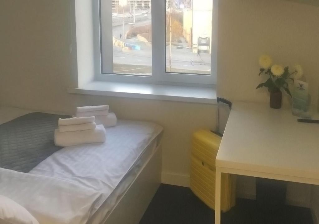 Postel nebo postele na pokoji v ubytování Kyivpasservis Hotel
