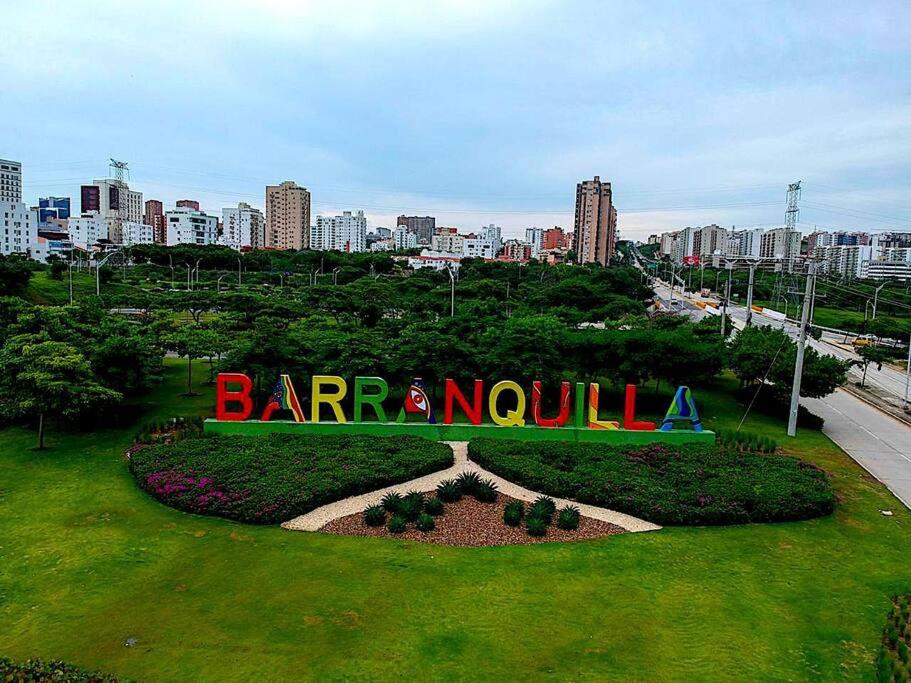 a park with a sign in the middle of a city at Hermoso apartamento en la Arenosa in Barranquilla