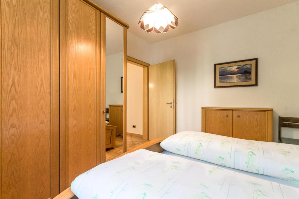 Postel nebo postele na pokoji v ubytování Casa Plaickner
