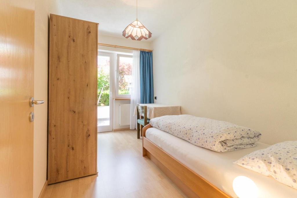 Postel nebo postele na pokoji v ubytování Casa Plaickner