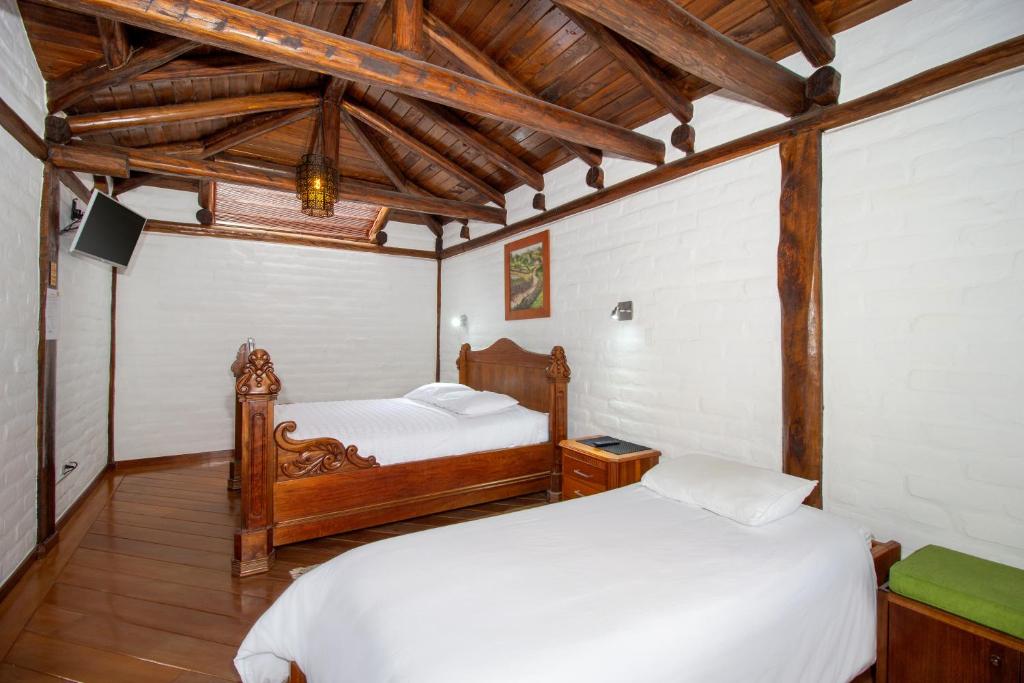 Postel nebo postele na pokoji v ubytování Hotel ILÉ