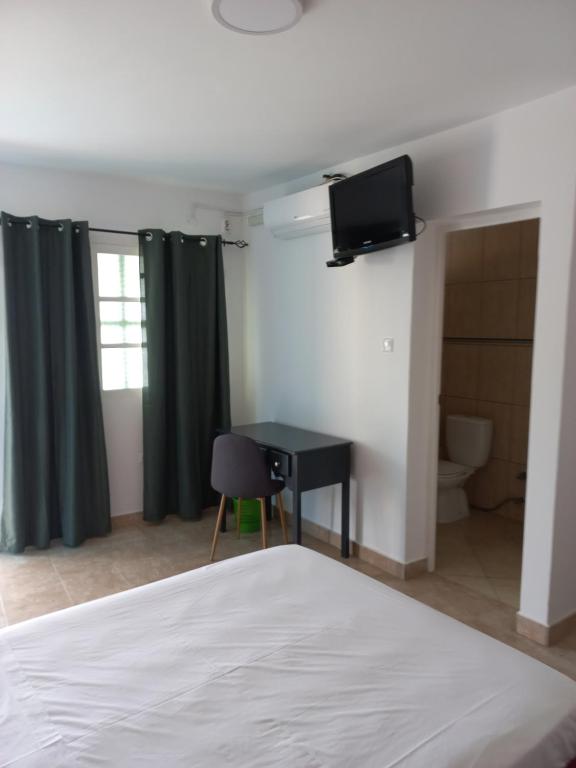 Postel nebo postele na pokoji v ubytování Hotel Savana