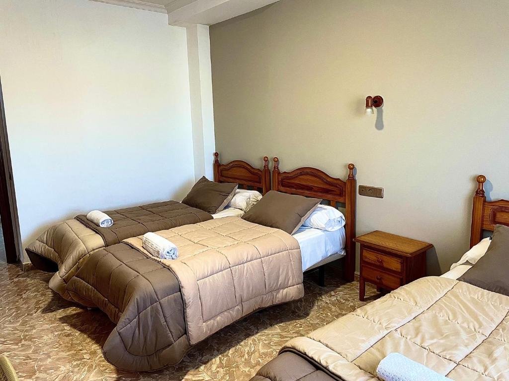 Postel nebo postele na pokoji v ubytování Hostal Torresmancha