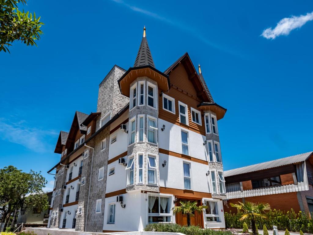 an image of a building with a turret at Locanda Casa D'Oro in Gramado