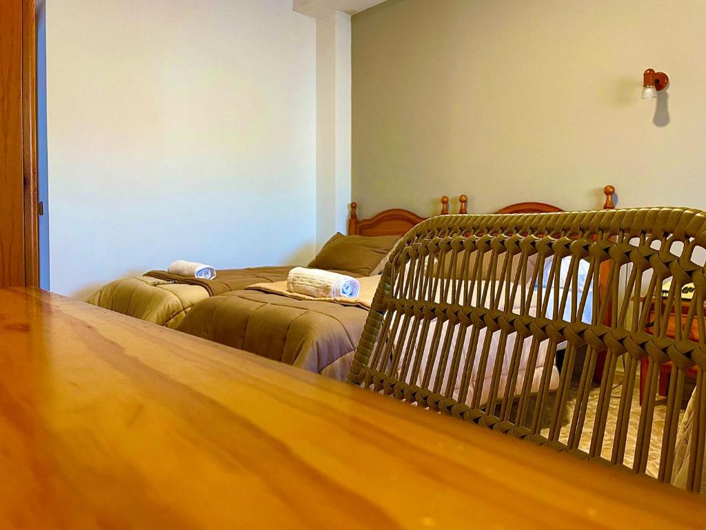 Postel nebo postele na pokoji v ubytování Hostal Torresmancha
