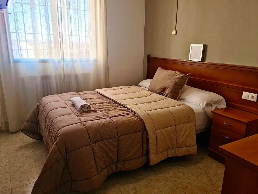 Postel nebo postele na pokoji v ubytování Hostal Torresmancha