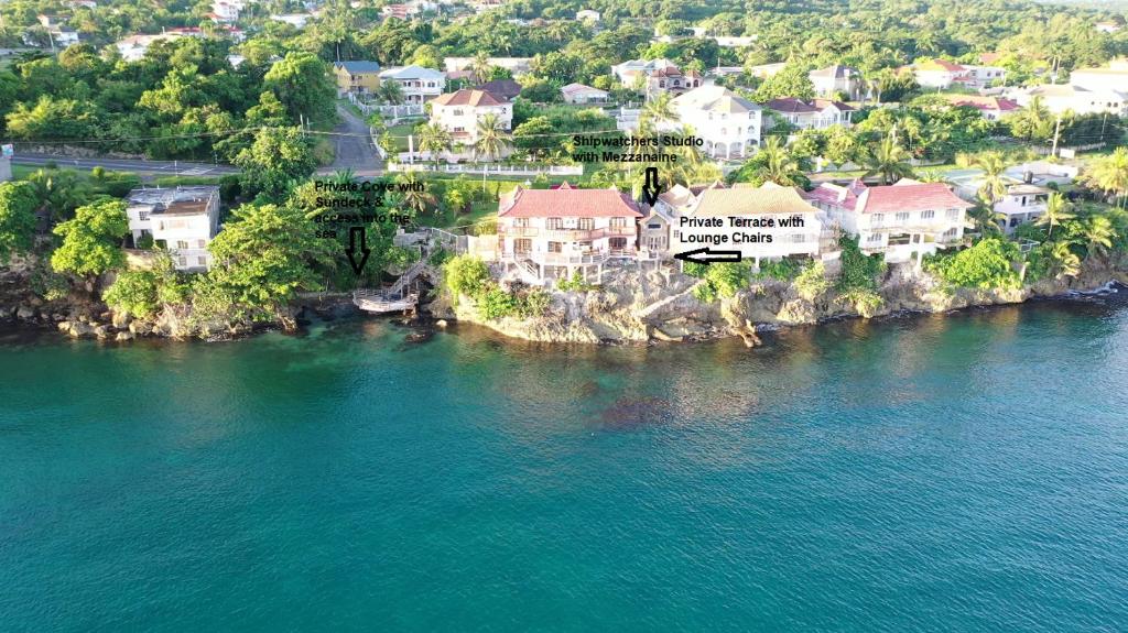 an aerial view of a town next to a body of water at Shipwatcher Studio w/Mezzanine in Ocho Rios
