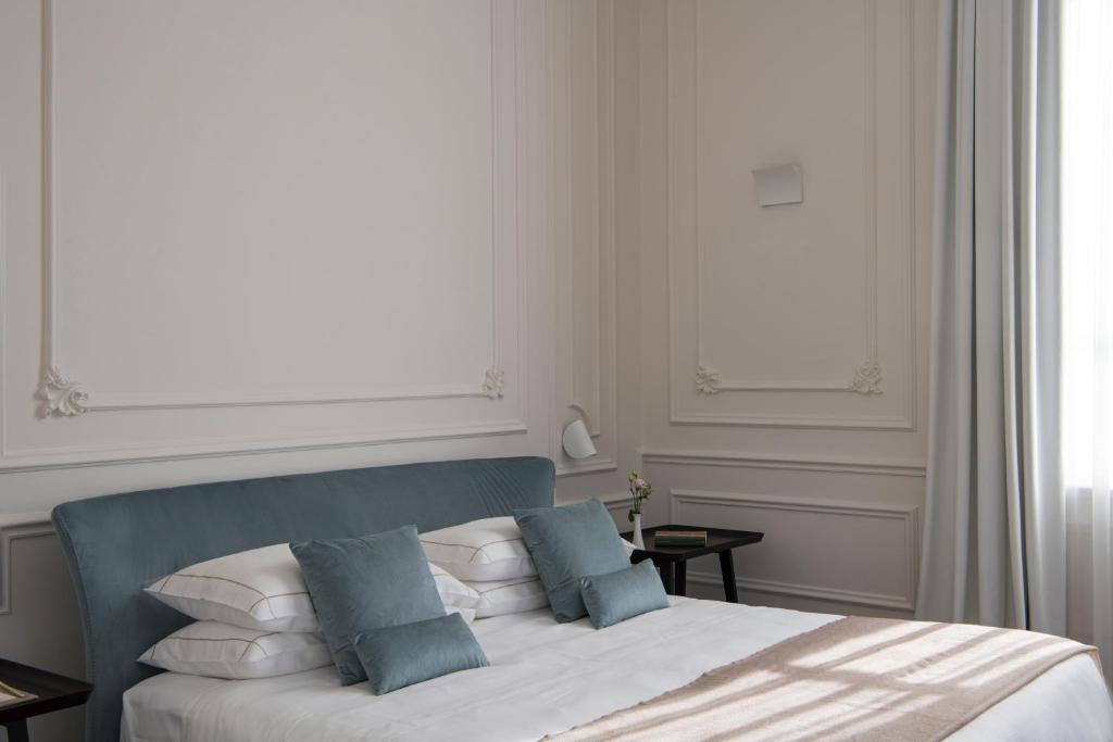 Postel nebo postele na pokoji v ubytování Dimora Palanca Boutique & SPA