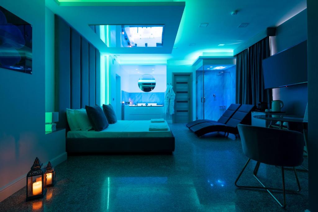 TV a/nebo společenská místnost v ubytování Hotel Ibisco Suites & Relax