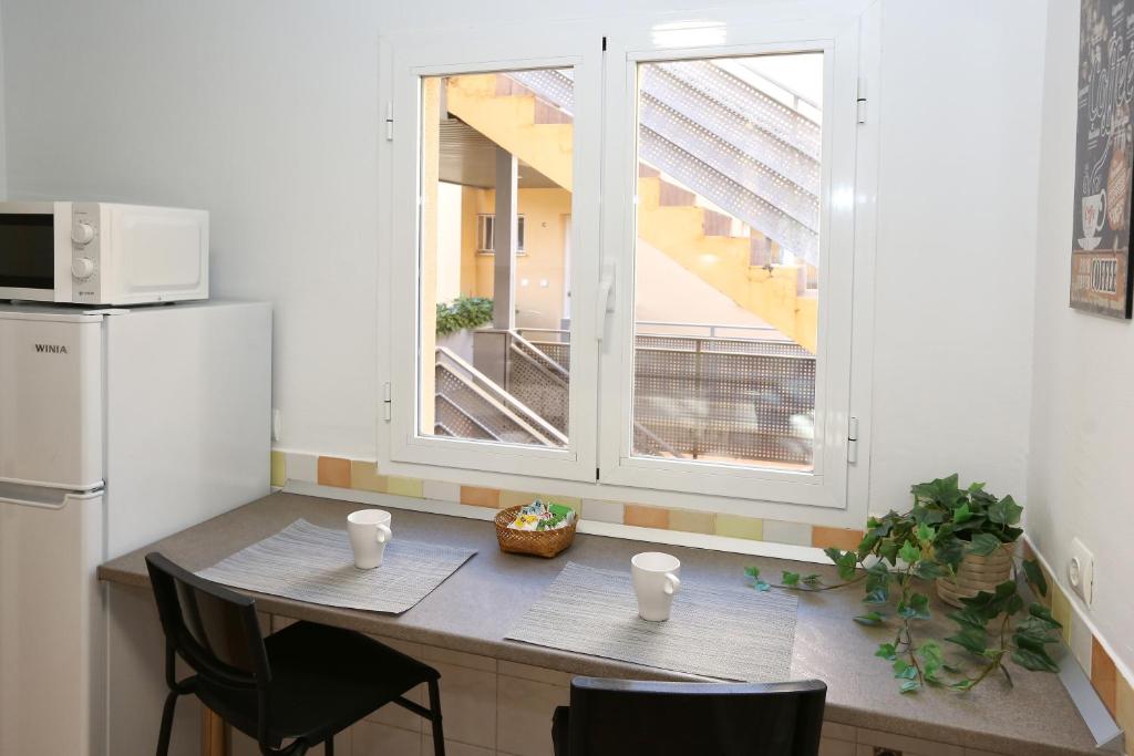 Kuchyň nebo kuchyňský kout v ubytování MONTESOL HOME - Parking Gratis