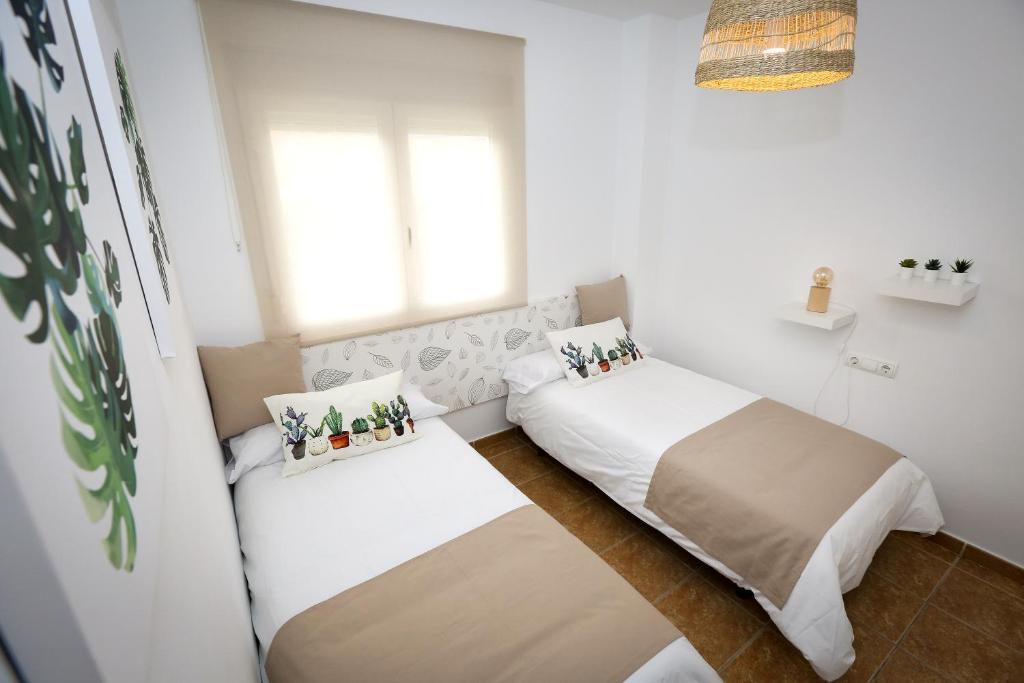 Postel nebo postele na pokoji v ubytování MONTESOL HOME - Parking Gratis