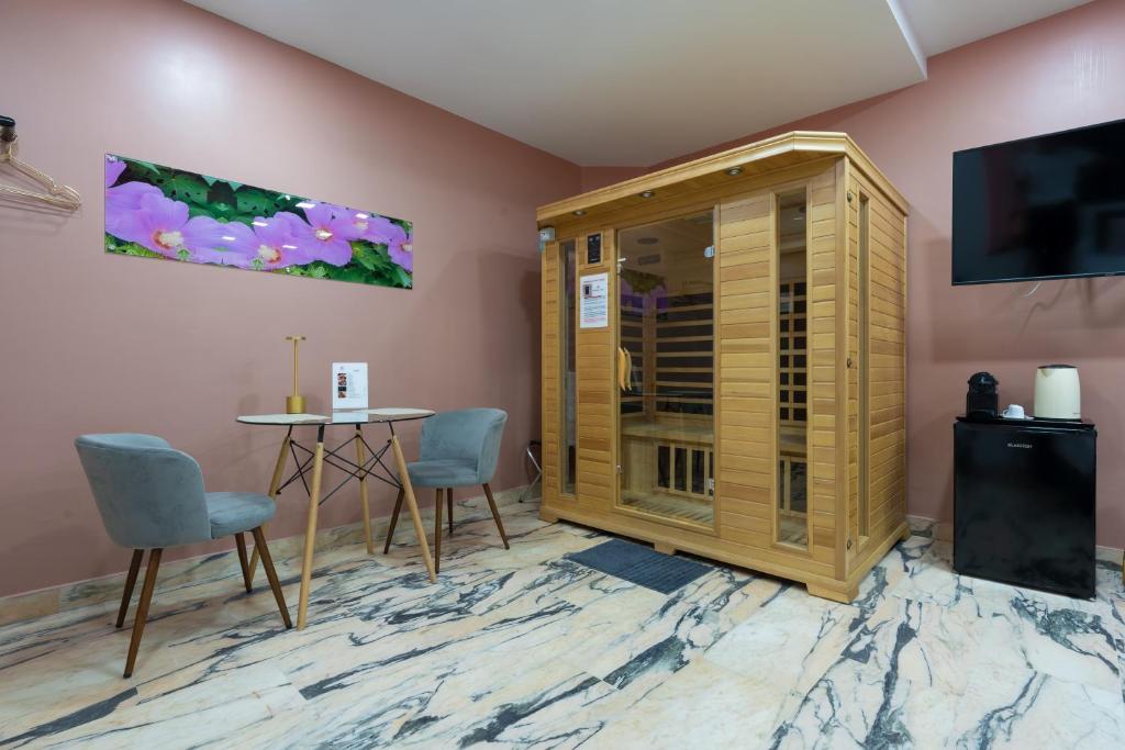 TV a/nebo společenská místnost v ubytování Hotel Ibisco Suites & Relax