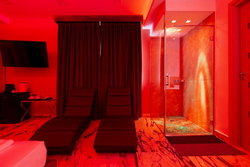 TV a/nebo společenská místnost v ubytování Hotel Ibisco Suites & Relax