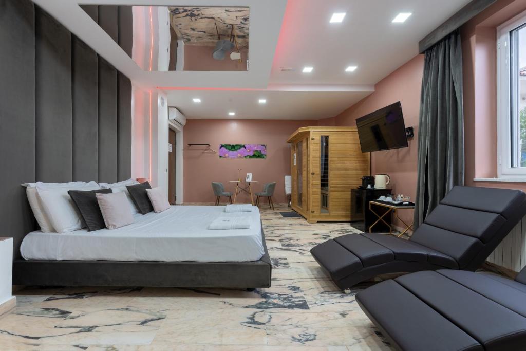 TV a/nebo společenská místnost v ubytování Hotel Ibisco Suites & Relax