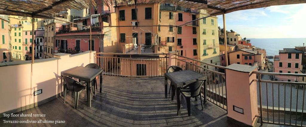 a view from a balcony with stairs and chairs at Affittacamere Albarola in Riomaggiore