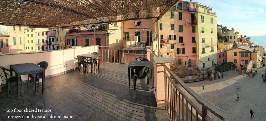a balcony with a view of a city with buildings at Affittacamere Albarola in Riomaggiore