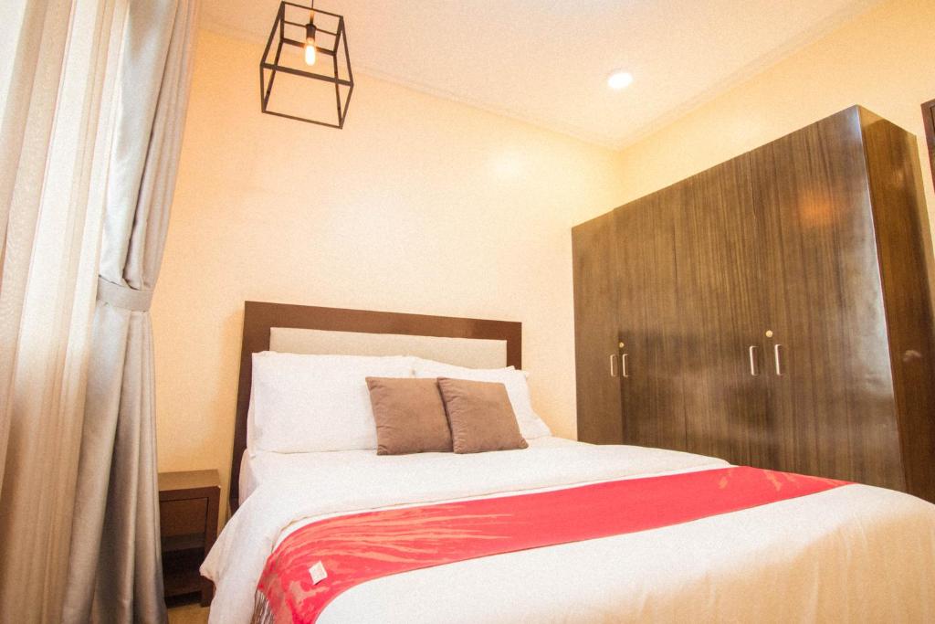 Postel nebo postele na pokoji v ubytování Bella Villa Coron