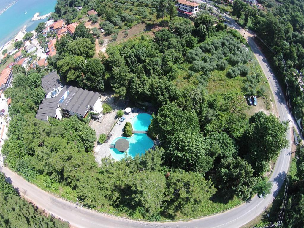 an aerial view of an island with a swimming pool at Miramare in Skala Potamias