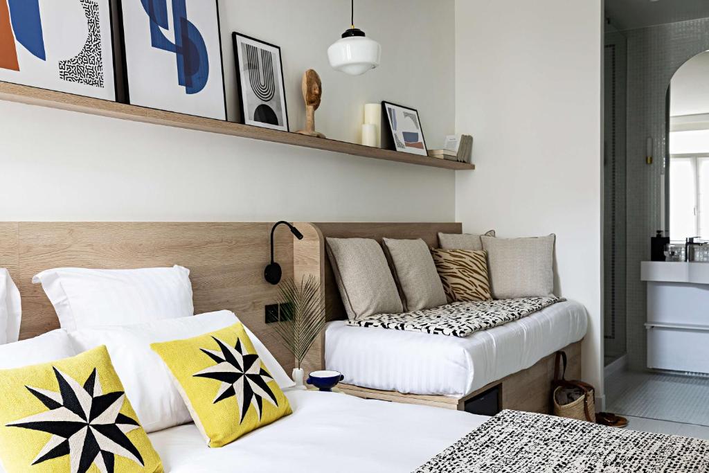 a living room with a couch and a bed at Le Riviera Collection, Signature Collection by Best Western in Nice