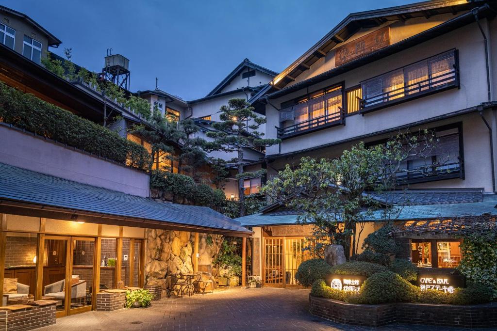 an exterior view of a building at night at Arima Onsen Tocen Goshobo in Kobe