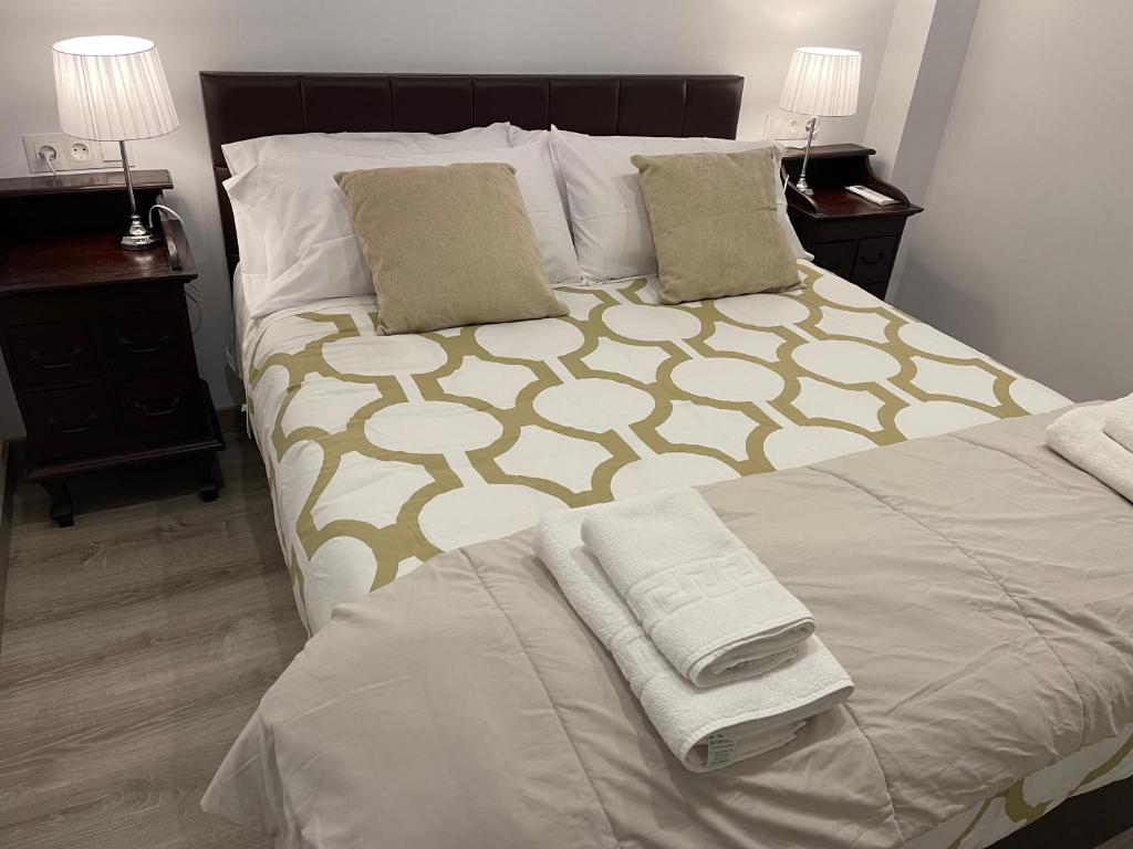 A bed or beds in a room at Nuestro Rinconcito del Soho