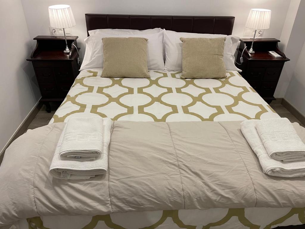 A bed or beds in a room at Nuestro Rinconcito del Soho