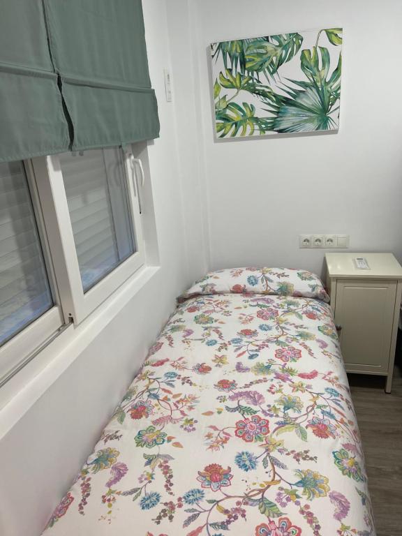 A bed or beds in a room at Nuestro Rinconcito del Soho