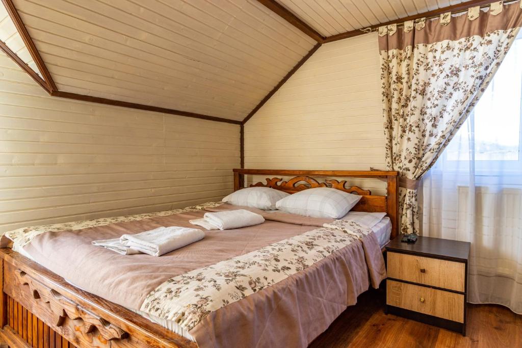 Postel nebo postele na pokoji v ubytování Smerichka