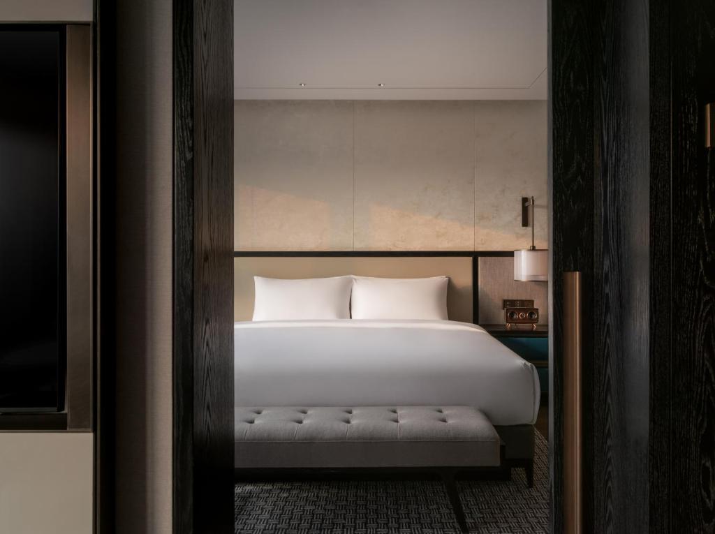 Postel nebo postele na pokoji v ubytování Prime Hotel Beijing Wangfujing