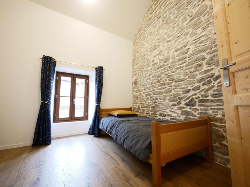 Postel nebo postele na pokoji v ubytování Gîte de Crémieu