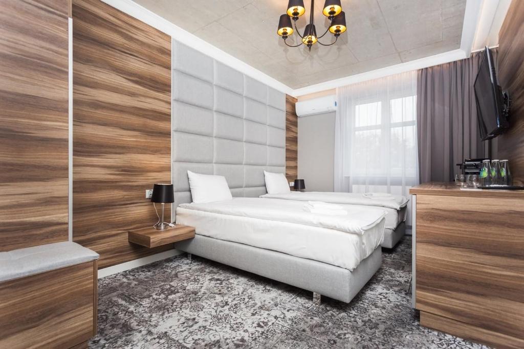 Posteľ alebo postele v izbe v ubytovaní Aparthotel Rakowicka Residence