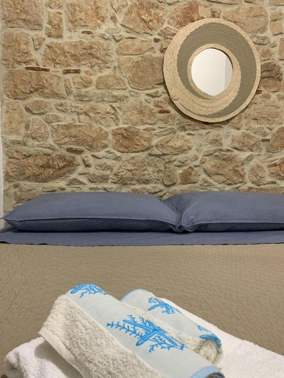 Postel nebo postele na pokoji v ubytování Casa di nonna Marianna