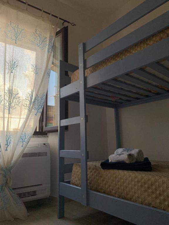 Postel nebo postele na pokoji v ubytování Casa di nonna Marianna