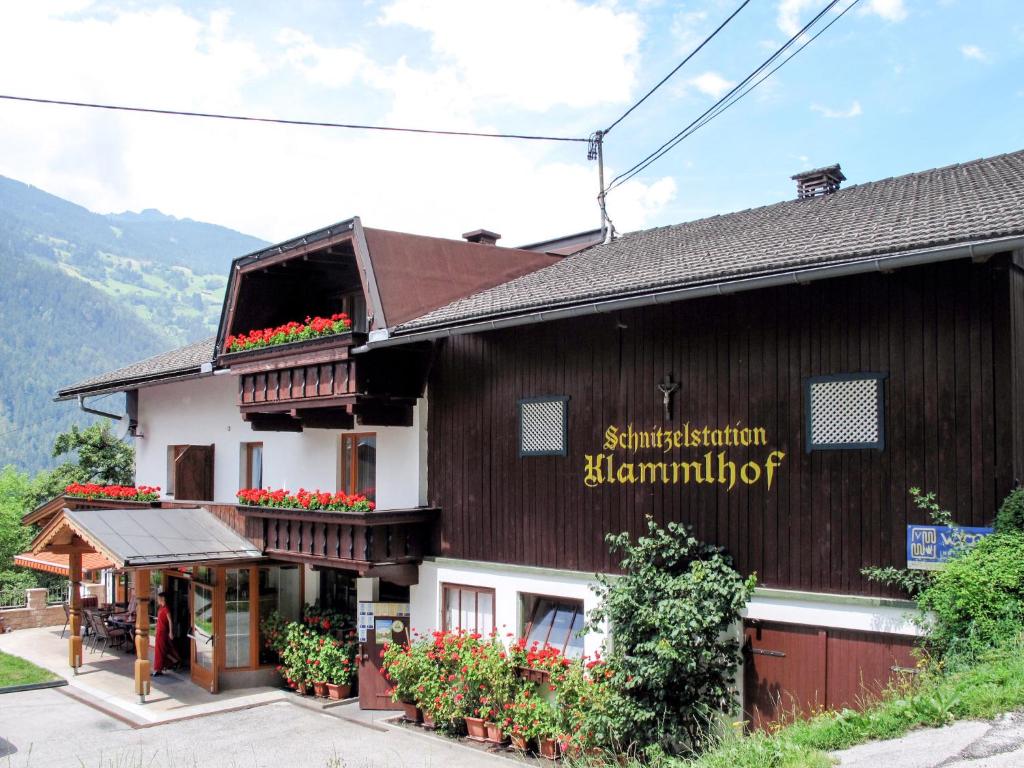 a building with flowers in front of it at Apartment Klammlhof - ZAZ307 by Interhome in Zell am Ziller