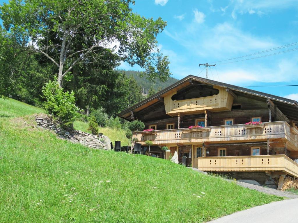 a house on the side of a hill at Chalet Alm Chalet by Interhome in Gattererberg